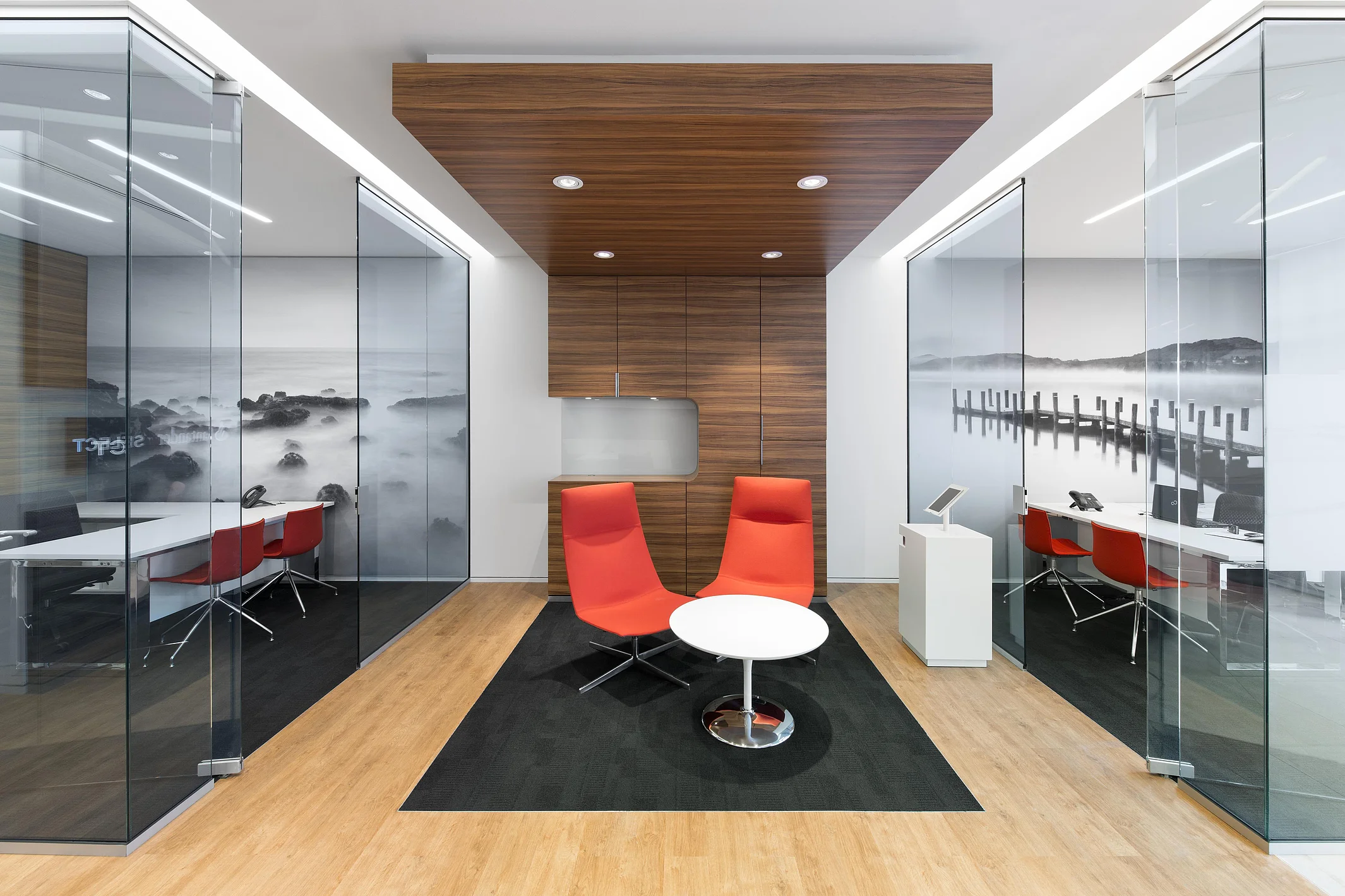 Right-and-left room-within-a-room solution with ceiling connection, featuring custom interior finishes in the center